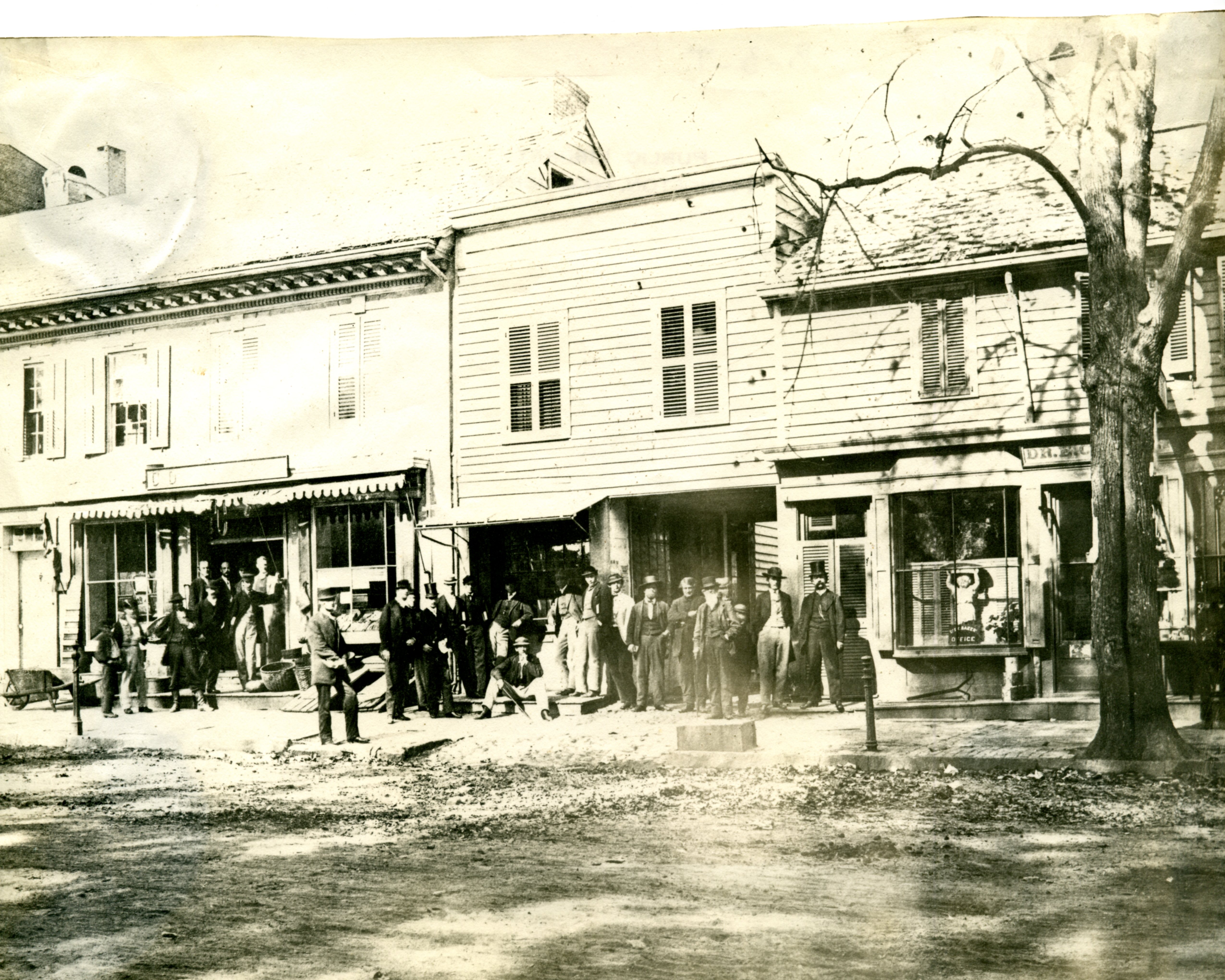 Group of men outside stores on Nassau Street