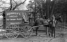 Man in front of Renwick's Bread Ice Cream & Pastry Wagon